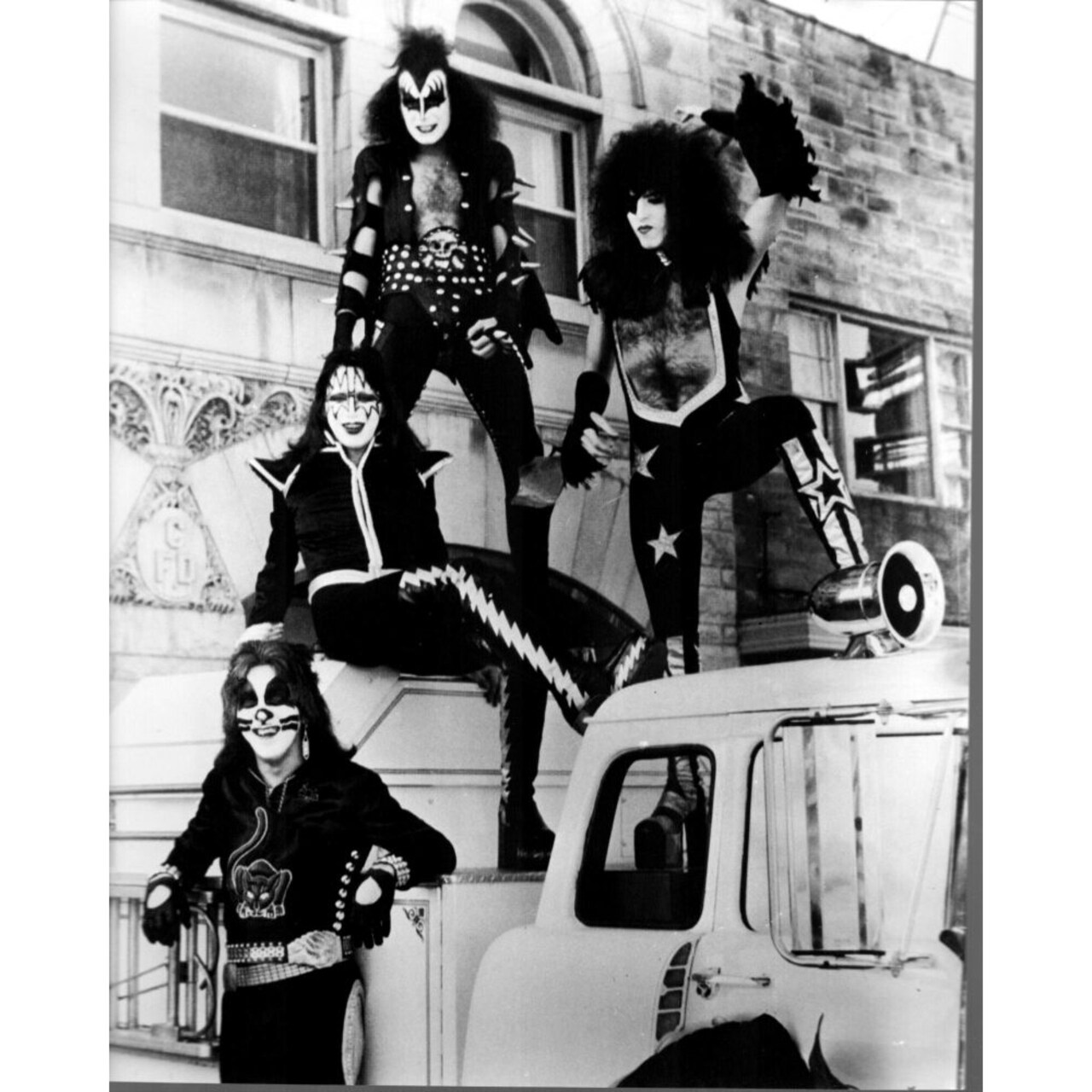 Posterazzi Kiss Band On Top Of Cars Black And White Photo Print - Item MVM02676